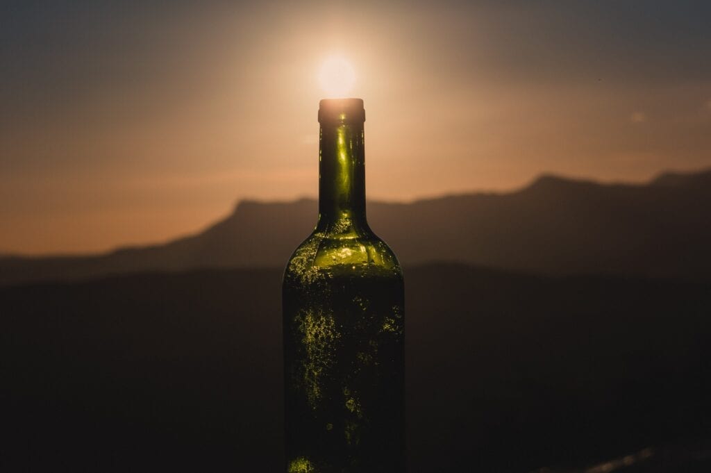 Wine bottle with setting sun, Gabriel P, Unsplash