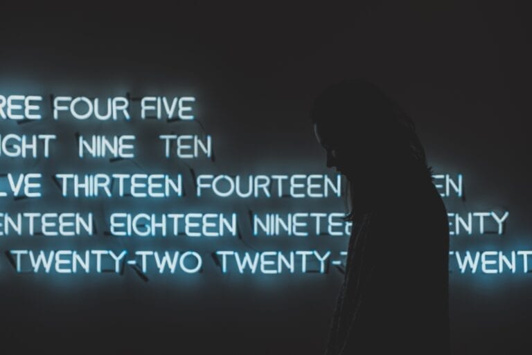 Numbers, silhouette of woman, photo by lnur Kalimullin on Unsplash