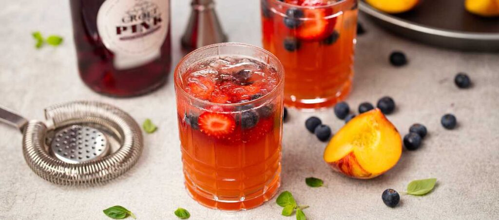 Croft Pink Port in a summer cocktail with peaches and berries