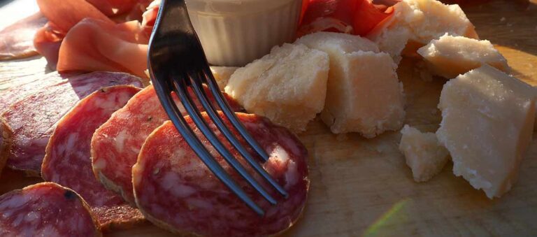Charcuterie board of Italian salumi cold cuts salami cheese meats