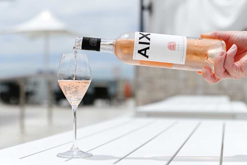 AIX rose wine by pool, a summertime sip but also great wine for fall