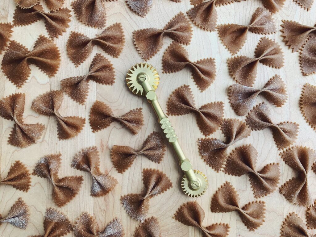 Cocoa farfalle with pasta cutter