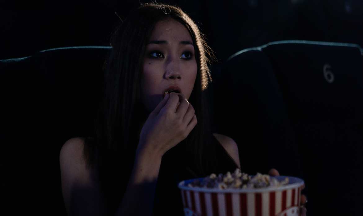 Eating popcorn at cinema