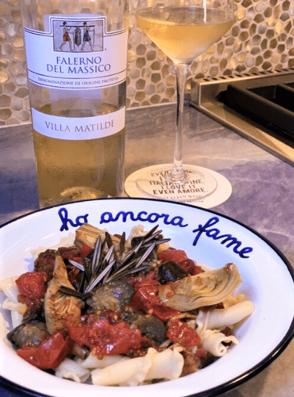 Pasta with rosemary, tomatoes, artichokes, and eggplant paired with Villa Matilde Falerno Bianco wine from Campania, Italy