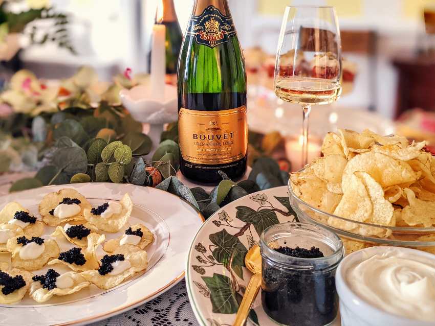 Bouvet Cremant de Loire wine with caviar and potato chips for Galentine's Day