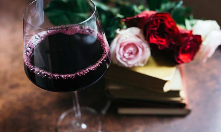 Nenad Stojkovic - Red wine and books with roses