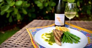 Grilled Swordfish with basil olive oil sauce and greenbeans and Bollini Chardonnay