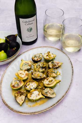 Stuffed baked figs with honey and pistachios, paired with Cakebread Cellars Chardonnay